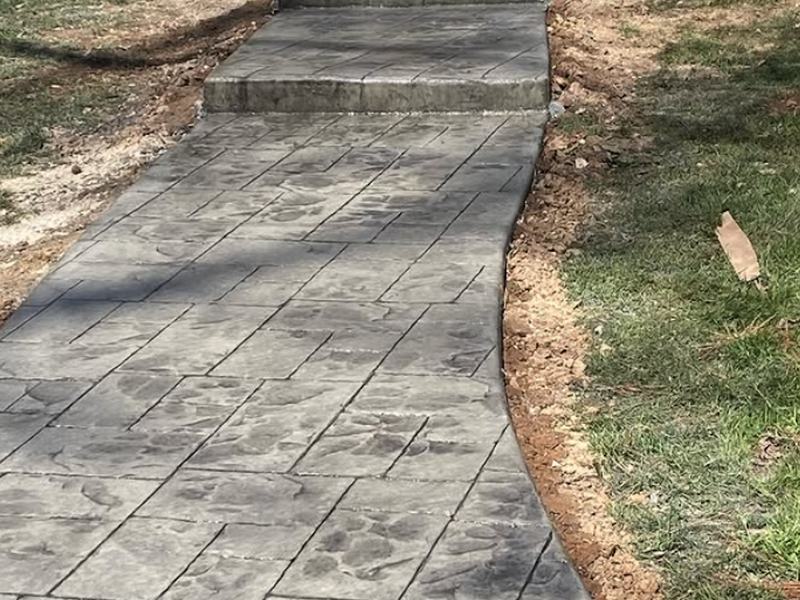 Stamped walkway with step